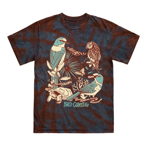 Sunset hurricane tie dye tee in maroon and dark teal tones with a bold graphic design featuring three birds, a tortoise, a snake, and several insects and plants--all native to Florida.